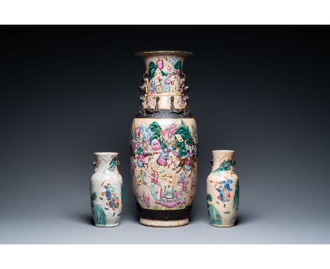 Full title: Three Chinese Nanking famille rose crackle-glazed vases, 19th C.Description:H.: 62,5 cm (the tallest vase)H.: 27 