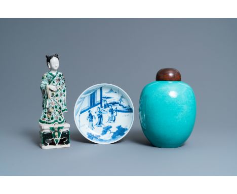 Full title: A Chinese verte biscuit figure, a green 'lotus' jar and a figurative blue and white plate, Kangxi and laterDescri