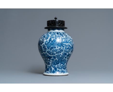 Full title: A Chinese blue and white 'phoenixes' vase, KangxiDescription:H.: 42,5 cm (incl. the cover)H.: 34 cm (the vase)The