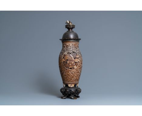 Full title: A Chinese reticulated biscuit 'Buddhist lions' vase mounted as a lamp, 19th C.Description:H.: 65,5 cm (the whole)