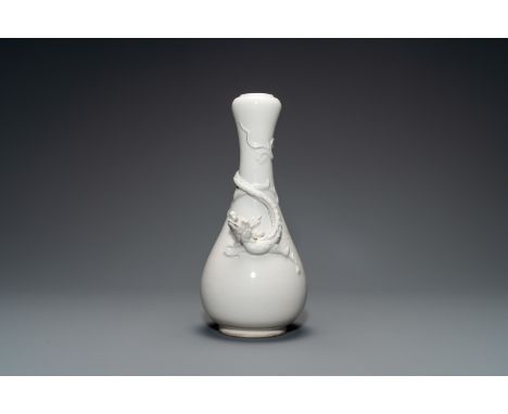 Full title: A Chinese Dehua blanc de Chine vase with applied dragon, Kangxi/YongzhengDescription:H.: 33 cmThe absence of a co