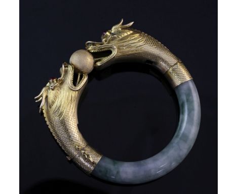 A gold and cabochon ruby set jade hinged bangle, A gold and cabochon ruby set jade hinged bangle, with dragon's head terminal