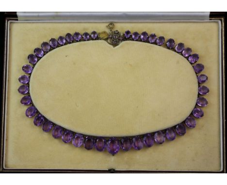 An early 20th century silver gilt and amethyst riviere necklace, 18.5in. An early 20th century silver gilt and amethyst rivie