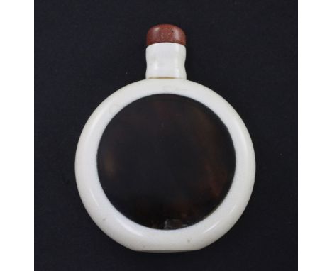 A Chinese ivory and tortoiseshell snuff bottle, early 20th century, 6.3cm A Chinese ivory and tortoiseshell snuff bottle, ear