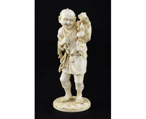 A Japanese ivory figure of a farmer, Meiji period, 16.5cm A Japanese ivory figure of a farmer, Meiji period, the farmer holdi