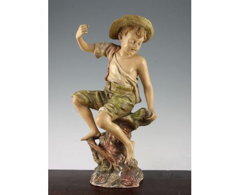 A late 19th century Goldscheider cold painted terracotta figure of fisherboy, modelled by Leroinbourg, 43.5cm A late 19th cen