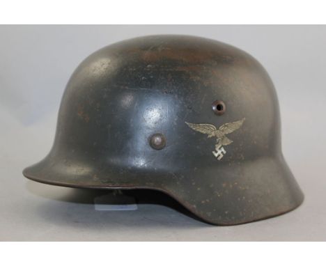A German Third Reich M35 Luftwaffe helmet, A German Third Reich M35 Luftwaffe helmet, with double decals and leather liner