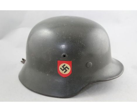 A German Third Reich M40 combat police helmet, A German Third Reich M40 combat police helmet, with double decals, leather lin