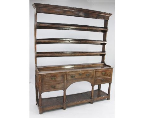 An 18th century oak dresser, W.5ft 7in. An 18th century oak dresser, the open plate rack with three fitted shelves above an a