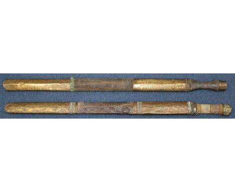 A Tibetan Dao or sword, largest 32.5in. incl. scabbard A Tibetan Dao or sword, with fish skin grip, together with another sim