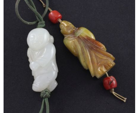 A Chinese white jade figure of a boy and a jadeite carving of a luohan, 3.7cm A Chinese white jade figure of a boy and a jade