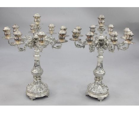 A large ornate pair of late 20th century silver plated nine light eight scroll branch candelabra, 33in. A large ornate pair o