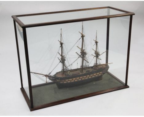 A model of an 18th century frigate, overall 40.5in. A model of an 18th century frigate, within a mahogany glazed display case