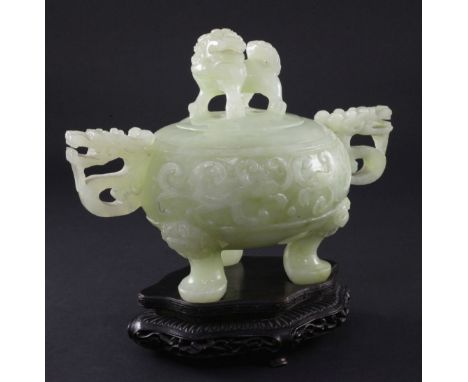 A Chinese pale green bowenite jade archaistic vessel and cover, 20th century, width 20cm, wood stand A Chinese pale green bow