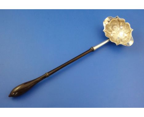 A George II silver toddy ladle, 12in. A George II silver toddy ladle, with turned wooden handle, the double lipped bowl embos