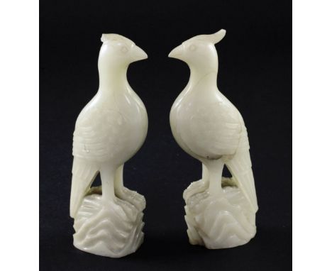 A pair of celadon-white jade standing figures of pheasants, 20th century, 4.3cm, chips to crests A pair of celadon-white jade