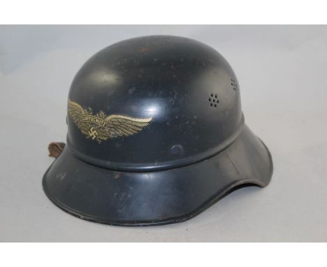 A German Third Reich Luftschutz M38 gladiator helmet, A German Third Reich Luftschutz M38 gladiator helmet, dark blue with gi