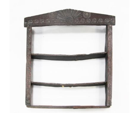 An 18th century carved oak plate rack, W.3ft 6in. An 18th century carved oak plate rack, with architectural top and three fit