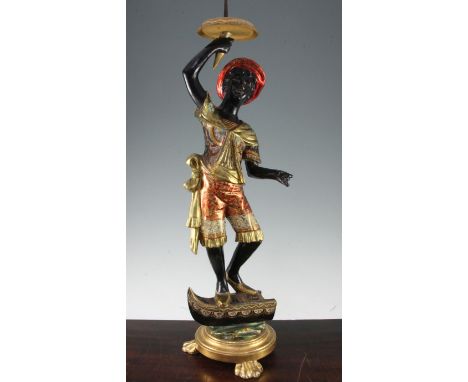 An Italian Venetian blackamoor pricket candlestick, 31in. An Italian Venetian blackamoor pricket candlestick, the gilt and po