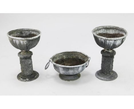 A pair of small lead garden urns, pair H.1ft 6in. A pair of small lead garden urns, with circular fluted bowls, each with a f