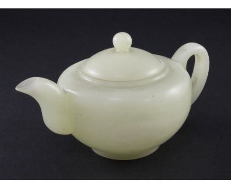 A Chinese pale celadon bowenite jade teapot, 20th century A Chinese pale celadon bowenite jade teapot, 20th century, with an 