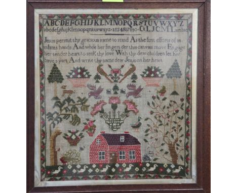 A 19th century needlework alphabet sampler, overall 22in. A 19th century needlework alphabet sampler, with religious verse, a