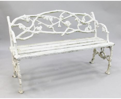 A Victorian 'rustic' white painted cast iron garden bench, W.4ft 4in. A Victorian 'rustic' white painted cast iron garden ben