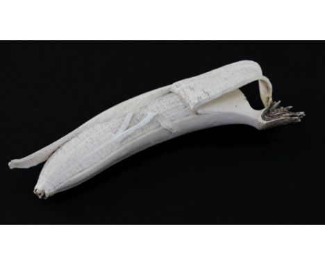 A Japanese ivory model of a partially peeled banana, early 20th century, 18.5cm. slight losses A Japanese ivory model of a pa