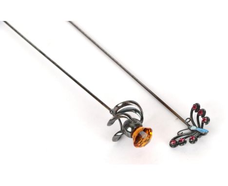Charles Horner Silver Hat Pin as a butterfly, hinged with a blue enamel body, and wings set with red stones; Another Charles 