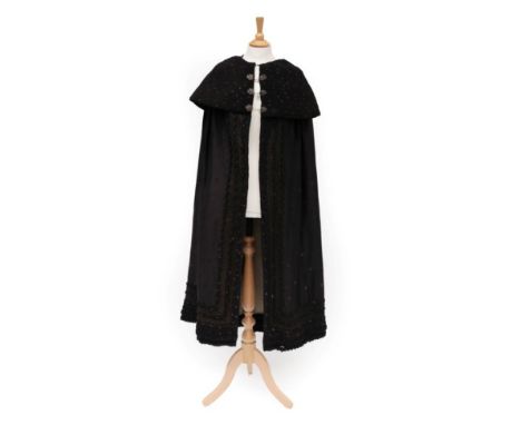 19th Century Black Wool Cloak, woven with purple floral sprigs with a deep 'concertina' collar, three decorative cloak clips,