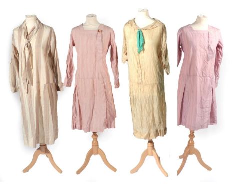 Four 1920s Day Dresses, comprising a dark cream collared dress, with button down details and attached turquoise bow; a cream,