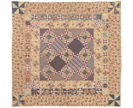 Early 19th Century Patchwork Quilt, with large central square incorporating printed patches in purple, pink, blue and ochre, 