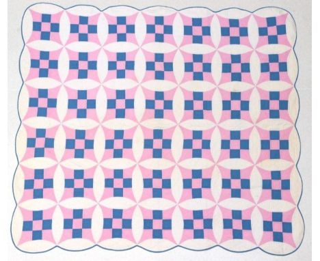Circa 1930s American Appliqué Quilt, decorated in a nine patch double wedding ring pattern in white, internally patched with 