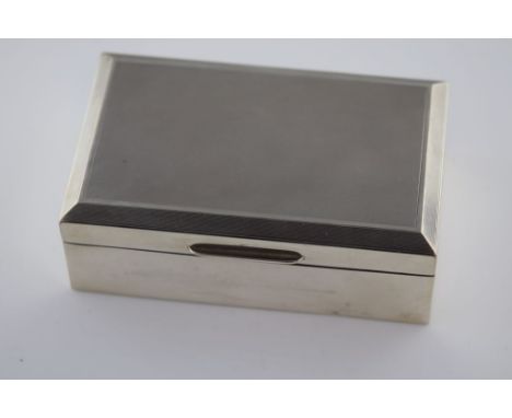 A mid 20th century silver cigarette box, Birmingham 1960, makers mark indistinct, engine turned lid and plain body, approxima