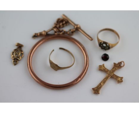 A 9ct yellow gold crucifix pendant, bright cut scroll decoration, a 9ct openwork scroll design pendant, an early 20th century