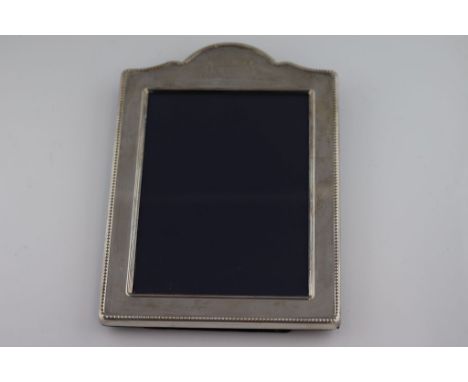 A 21st century silver photoframe of shield form, beaded border and engraved initials, Sheffield 2008 Carr's of Sheffield Ltd,