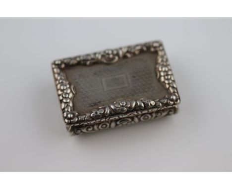 Nathaniel Mills, a William IV silver vinaigrette, engine turned lid with blank cartouche and cast floral border surround in r