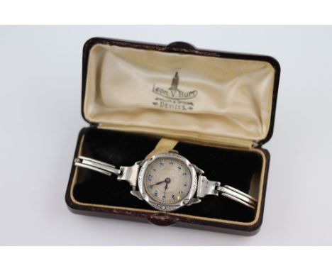 A ladies silver wristwatch, circa 1930s, blue Arabic numerals, black elongated poker hands, engraved laurel leaf case surroun