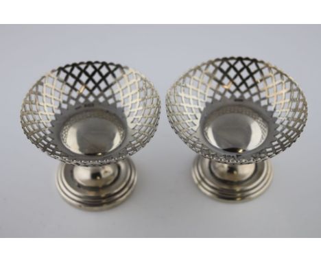 A matched pair of Walker and Hall silver pedestal bon bon dishes, pierced circular basket raised on stepped circular foot, Sh