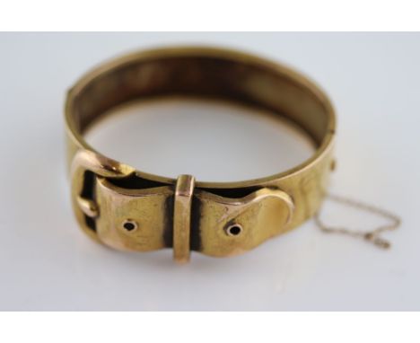 A Victorian 9ct yellow gold buckle hinged bracelet, re-assayed with modern hallmark, complete with safety chain, bangle width