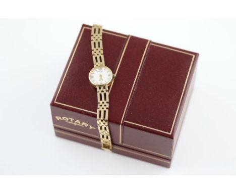 A ladies 9ct yellow gold Rotary Elite wristwatch, white dial with gold baton and Roman numerals and hands, 9ct yellow gold in