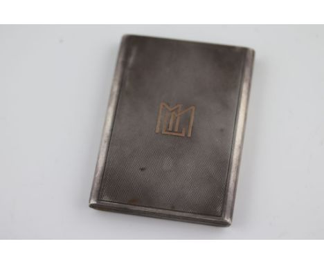 An Asprey silver cigarette case, London 1929 Asprey and Co Ltd, engine turned design with gilt MLM initials to front, gilt in