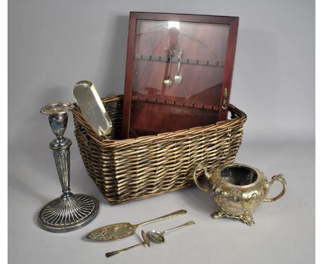 A Wicker Basket Containing Various Silver Plated Items to include Crumb Scoop, Candlestick Etc 