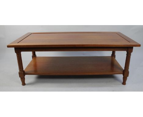A Modern Rectangular Coffee Table with Turned Supports and Stretcher Shelf, 121cms Wide 