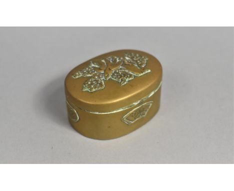 A Vintage Pressed Brass oval Pill Box, Hinged Lid Decorated with Bird and Tree, 5.25cms Wide 