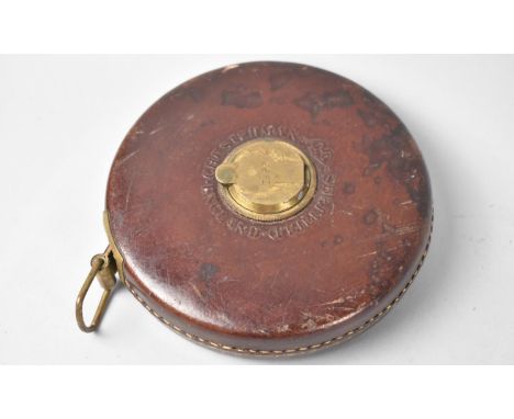 A Vintage Leather Covered Chesterman 66 Foot Tape Measure, 13cms Diameter 