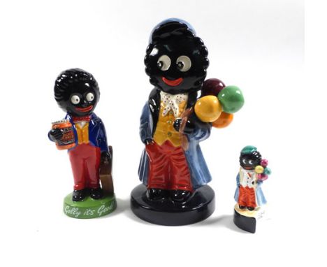 A Carlton Ware limited edition figure in the form of a 'Golly-balloon seller', No. 26/100, h. 19 cm, a similar figure, smalle