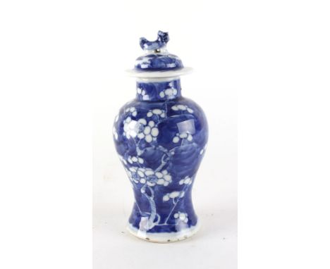 A 19th century Chinese blue and white teapot of globular form decorated with panels of flowering shrubs, h. 8.5 cm, together 