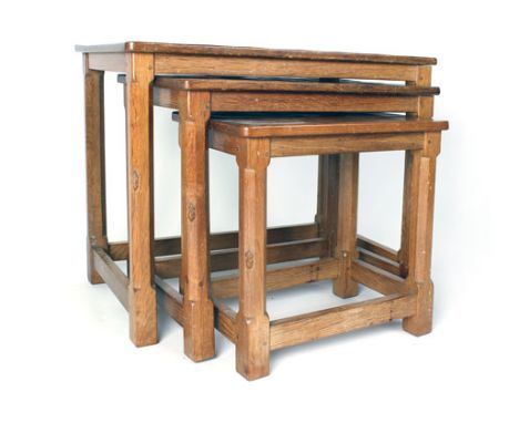 A Robert 'Mouseman' Thompson oak nest of three tables on octagonal legs with the mouse signature, max. w. 60 cm  CONDITION RE