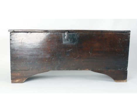 A 17th century and later oak six plank coffer on bracket feet, l. 111 cm CONDITION REPORT: Later brackets, shrinkage, normal 